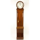 An Art Deco style mahogany Longcase Clock, the circular painted dial with Roman numerals in a