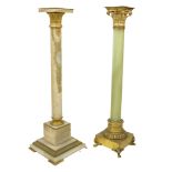 Two similar French onyx Plinths, one with Corinthian ormolu capital on cylindrical stem with