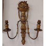A pair of carved giltwood two branch Wall Lights, each crested with a vase of flowers, issuing swags