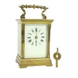 A heavy brass five glass French Carriage Clock, the white dial with Roman numerals and with swing