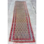 An attractive antique Persian Carpet, the fawn ground centre with stylised flower and cream and