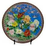 A massive Japanese cloisonne enamel Charger, profusely decorated with birds and colourful flowers,