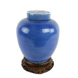 A late 19th Century / early 20th Century blue ground Chinese bulbous Jar and Cover, (pierced at base