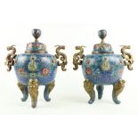 A pair of 19th Century Chinese cloisonné dragon handled blue ground and floral decorated bulbous