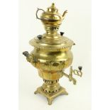 A 19th Century brass Samovar, with original teapot shaped and turned handles on platform base with