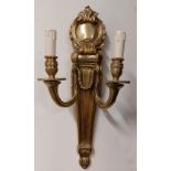 A pair of cast brass quiver shaped two branch Wall Lights, each with cartouche crest and hanging