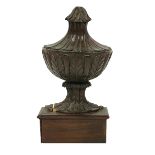 An 18th Century carved Finial, with leaf design, 41cms (16") high, as is. (1)