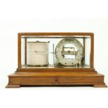 A very good oak cased Barograph, with manual silverised dial inside a cover with five bevelled glass