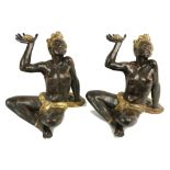 A pair of attractive semi-nude Nubian seated Female Figures, each approx. 54cms high (21"). (2)