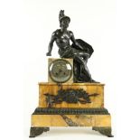 A French Empire period bronze and marble Mantle Clock, the top surmounted by a gladiator seated on a