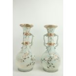 A pair of Japanese two handled Satsuma Vases, (one lacking a handle) each with a long neck with