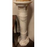 A late 19th Century Alabaster Plinth, with two stage cylindrical stem with end circular top on