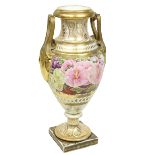 An early 19th Century French porcelain Vase, with two leaf moulded gilt handles, the body