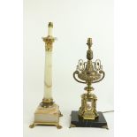 A French style gilt metal Table Lamp, of urn form with porcelain panels on a polished limestone