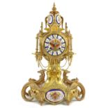 A 19th Century French Mantel Clock, of mythical design, decorated with colourful porcelain panel and