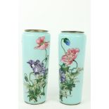 A very attractive pair of Japanese sky blue ground cloisonné enamel Vases, with colourful flowers,