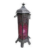 A heavy pierced cast iron Oil Heater, of hexagonal form on cast iron legs, converted to a lamp,