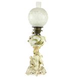 A fine quality Moore Brothers porcelain Oil Lamp, Reg. No: 16446, with flower encrusted reservoir on