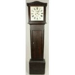 A Victorian Irish oak cased Provincial Grandfather Clock, the unusual cornice with Arabesque design,