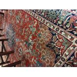 An attractive antique style Middle Eastern Carpet, the large central panel depicting figures in