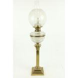 A very fine late 19th Century Corinthian brass Oil Lamp, with reeded column on square stepped base