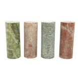 A pair of speckled green marble Plinths, of cylindrical form and a pair of rouge marble ditto,