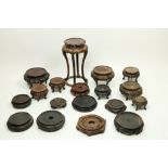 A collection of Chinese cherrywood and other wooden Stands, of different sizes and height, all