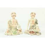 A pair of 19th Century Japanese porcelain Figures, of seated Ascetic Shaman with coloured