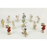 An 8 piece miniature Naples porcelain Orchestra, figures with various  instruments, 4 1/2" (11.