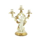 A 19th Century Moore Brothers two branch three light Candelabrum, in white and parcel gilt,