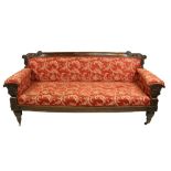 A large Irish William IV rosewood and grained rosewood Settee, by Williams & Gibton, the top rail