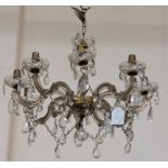 A 19th Century eight branch single tier Chandelier, with droplets and holders and shaped