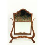 A George III style mahogany arch top swing frame Mirror, of shaped fret cut lyre frame, 19" (49cms).
