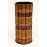 A cylindrical composition Stick Stand, modelled with faux leather book spines, 19 1/2' (50cms). (1)