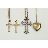 An engraved Locket, with gold chain, a gold link Chain with crucifix and two other crucifix