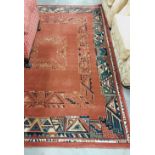An Art Deco style burgundy ground woollen Carpet, with typical geometric design, 231cms x 163cms (