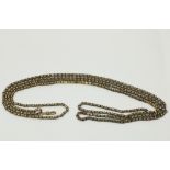 A gold link Chain, of long proportions with fob link, approx. 30" (76cms) long. (1)