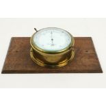 A circular bass compensated Ships Barometer, by John Lilley & Son, Limited, London & North