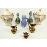 A pair of hand painted Nippon Vases and covers, each of hexagonal baluster form with two handles,