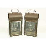 A pair of hand held or wall mounted copper Oil Lanterns, each with three glass panels, under a domed