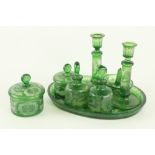 An unusual Bohemian 8 piece green glass etched Dressing Table Set, comprising pair of