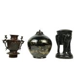 A black ground Chinese Dragon Vase, with wooden cover and six character mark, 10" (26cms);