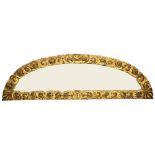 A fine and unusual demi-lune shaped carved giltwood 19th Century Over-Door, profusely carved with