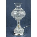 A Tipperary crystal Table Lamp, with bulbous shade on circular stainless base, 17" (44cms). (1)