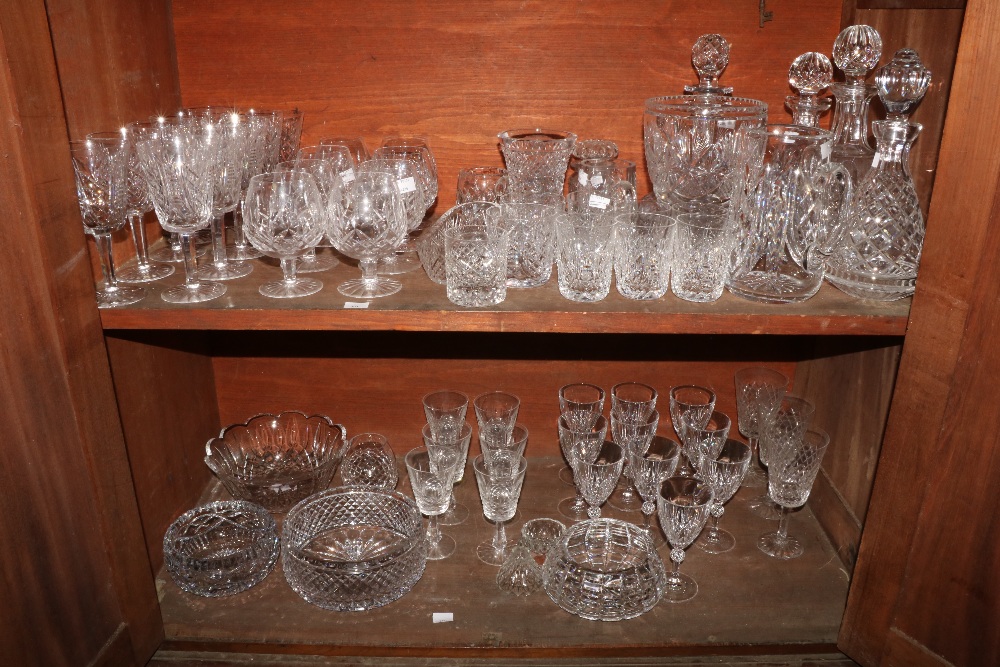 A collection of Waterford and other crystal Glass, comprising four decanters, a pair of jars with