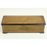 A 19th Century walnut cased and inlaid Continental Music Box, decorated with musical and floral