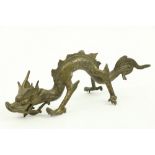 A Chinese Figure, of a crawling dragon lacking one leg and a whisker, 24cms (9 1/2"). (1)