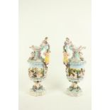 A pair of Italian Capodimonte Ewers, 20th Century, each relief moulded with classical figures, and