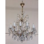 A fine quality Continental twelve branch Chandelier, with scrolled arms and multiple large droplets,