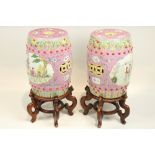 A pair of attractive Chinese Famille Rose barrel shaped Garden Seats, each with pierced top with